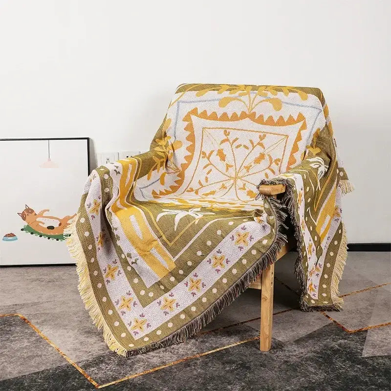 A cozy decorbites bohemian classic throw blanket with mustard yellow olive green floral patterns on white background