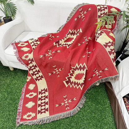 Red woven throw blanket with cream and maroon geometric patterns and fringed edges bohemian classic design thread