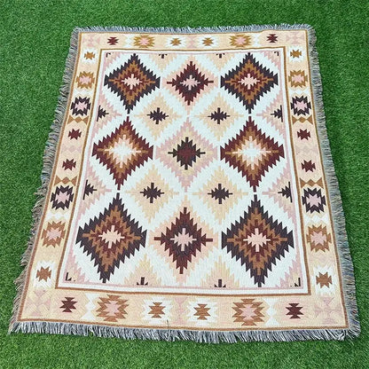 Rectangular woven throw blanket with beige brown cream geometric pattern and fringed edges from decorbites bohemian classic design thread collection