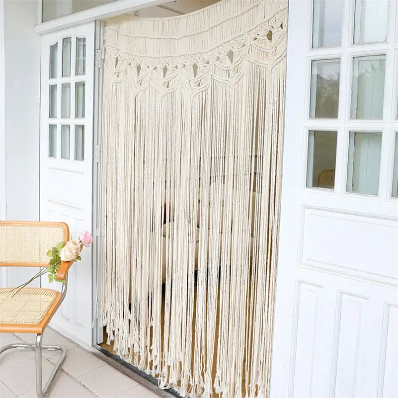 Cream-colored bohemian cotton macrame wall hanging with intricate woven patterns and long dangling cords decorbites bohemian cotton macrame decor
