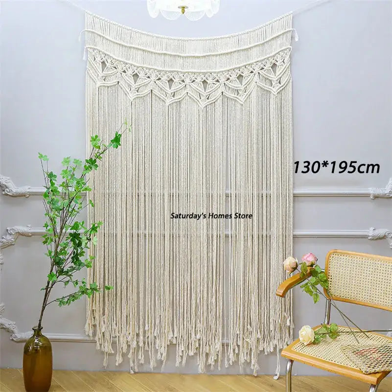 Cream-colored bohemian cotton macrame wall hanging with intricate woven patterns and long fringe decorbites bohemian cotton decor