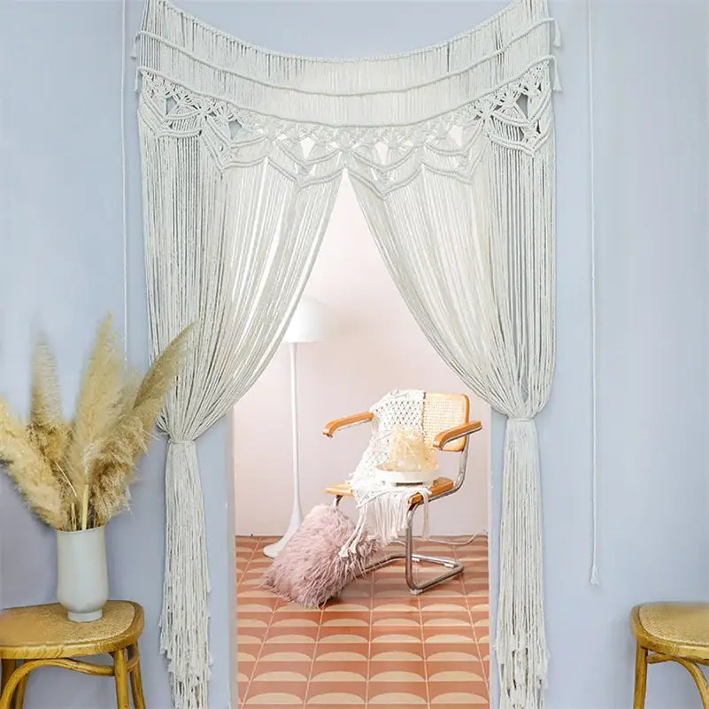 Cream-colored bohemian cotton macrame wall hanging with intricate knotwork and long fringe for bedroom decorbites decor