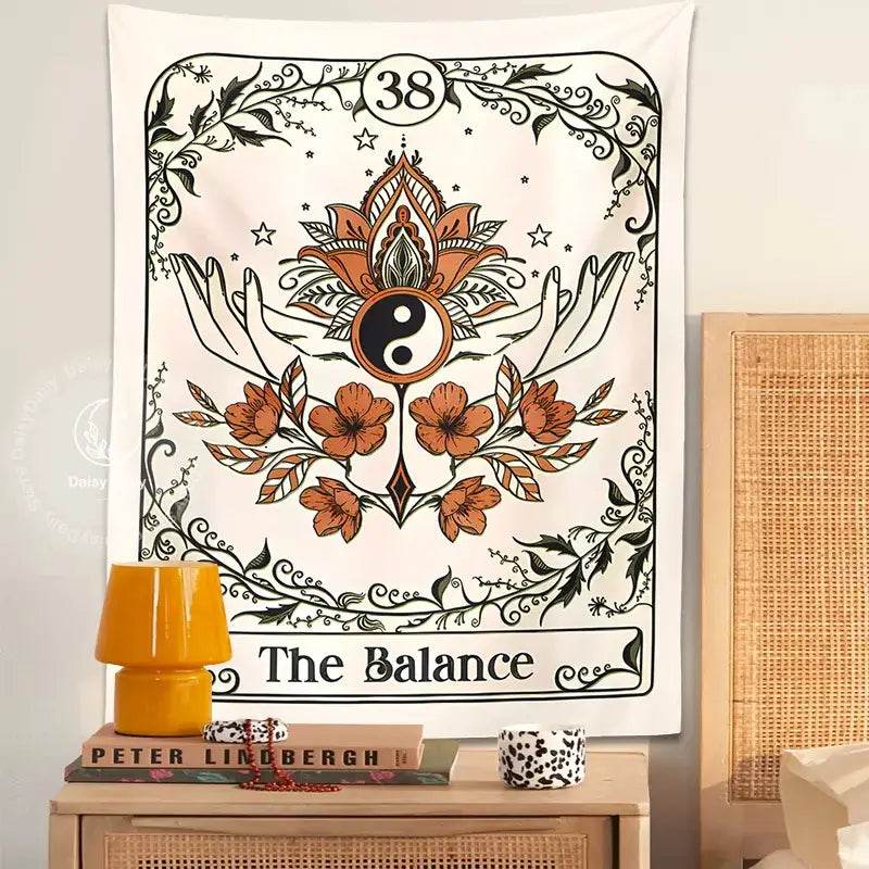 Cream balance tarot tapestry wall hanging with intricate orange and black floral patterns and central yin-yang symbol