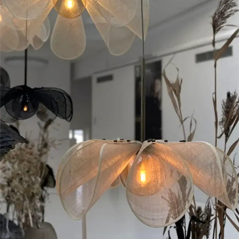 Delicate cream fabric flower chandelier with warm glowing bulb center for bohemian dining room lighting