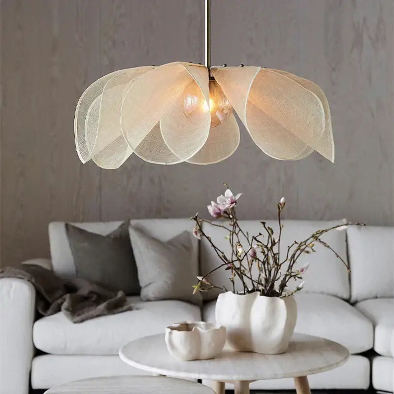 Bohemian cream fabric flower chandelier with layered petal-like shades suspended from metallic rod for dining room lighting