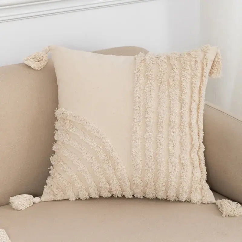 Cream-colored bohemian tassel cushion cover with textured fringe and decorative tassels for living room decor by decorbites