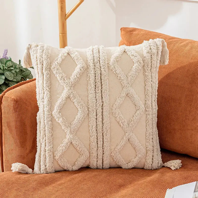 Cream-colored woven diamond cushion covers with tassels for living room decor by DecorBites Bohemian tassel collection