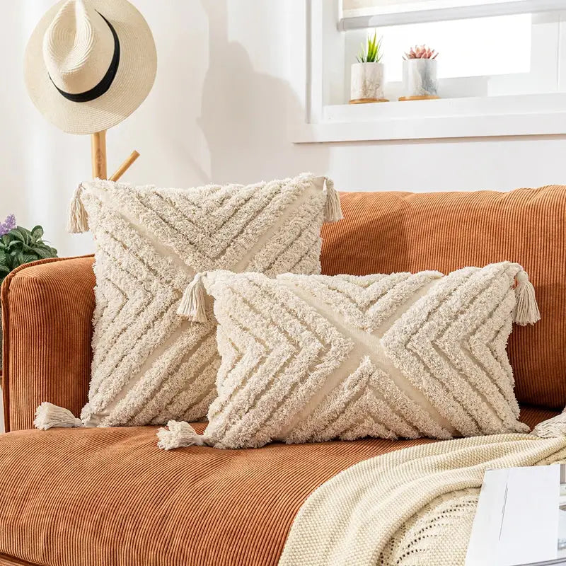 Cream-colored woven chevron cushion covers with tassels for living room decor by decorbites bohemian tassel collection
