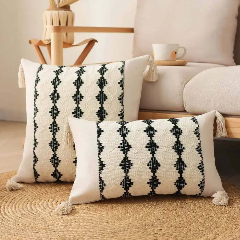 Cream-colored rectangular cushion cover with black geometric embroidery and tassels bohemian tassel cushion decorbites