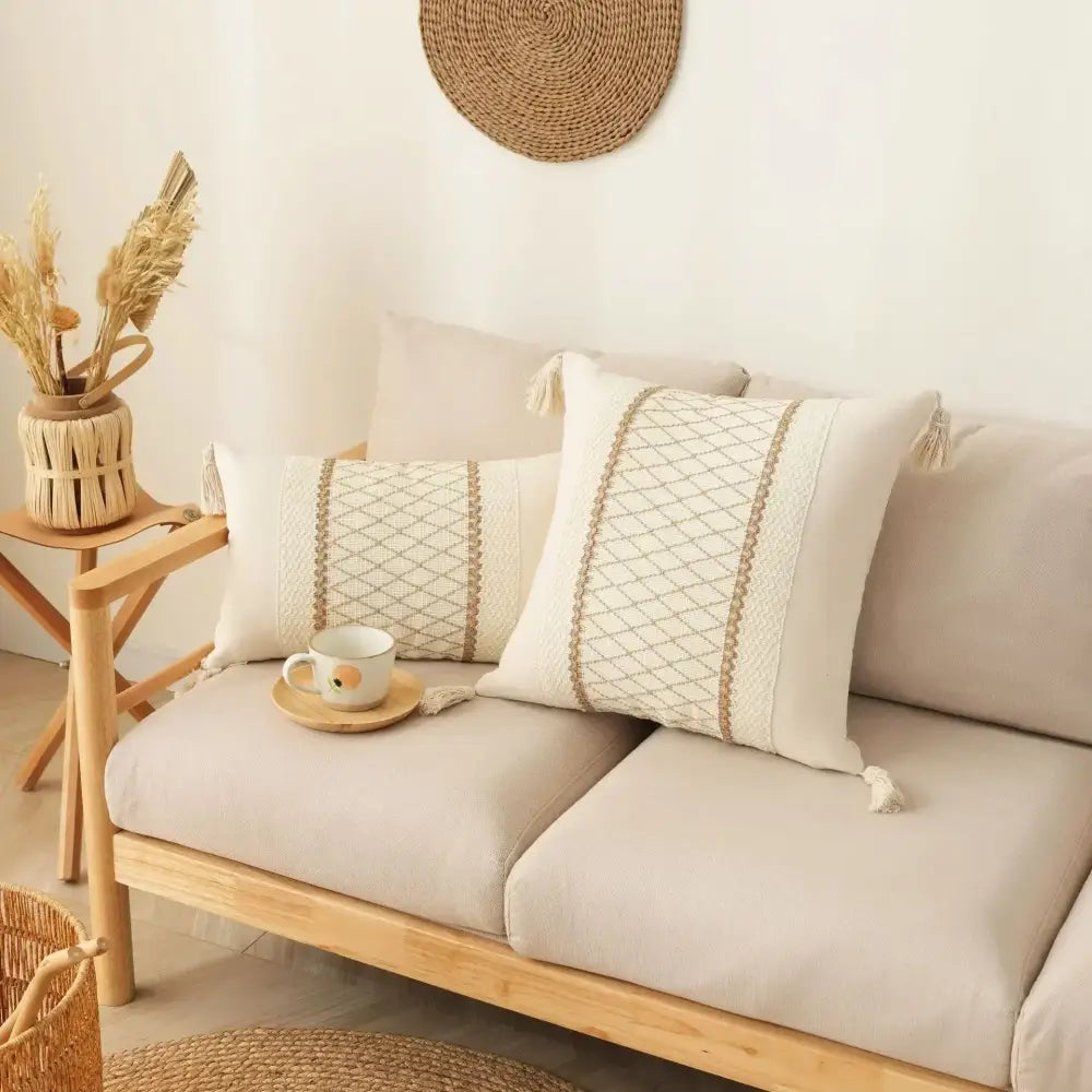Cream-colored bohemian tassel cushion cover with beige geometric embroidery and tassel trim for living room decorbites decor