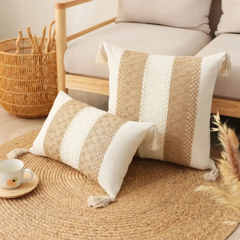 Two beige and cream bohemian tassel cushion covers with woven stripes and decorative tassels by decorbites