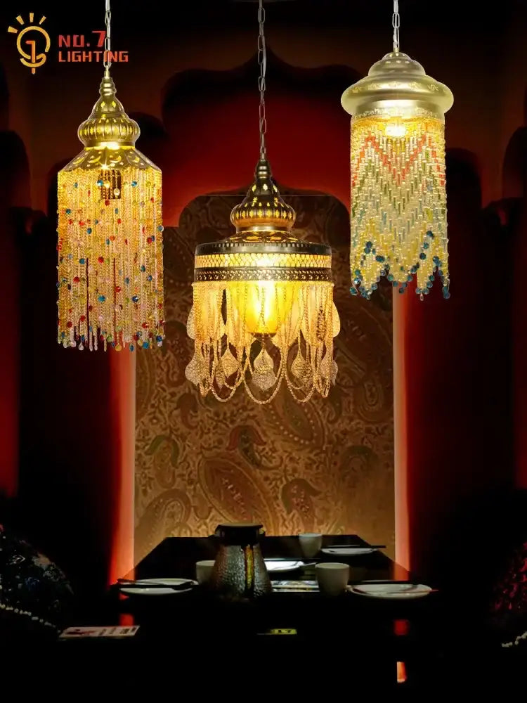 Three ornate bohemian crystal pendant lights with gold frames and beaded fringe in amber red and blue tones for dining room decorbites bohemian crystal pendant
