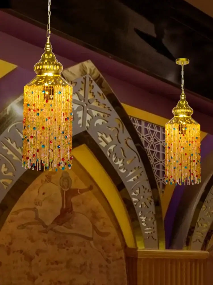 Golden beaded bohemian crystal pendant light with cascading colorful glass beads and ornate metalwork for dining room decorbites chandelier