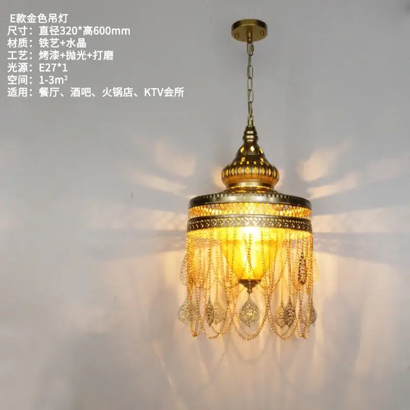 Golden ornate decorbites bohemian crystal pendant light with intricate metalwork and dangling crystals for dining room decor