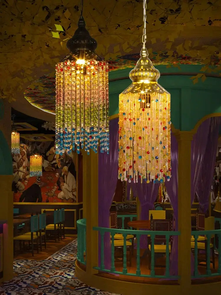 Golden bohemian crystal pendant light with cascading rainbow-colored glass beads for black and gold dining room decorbites chandelier