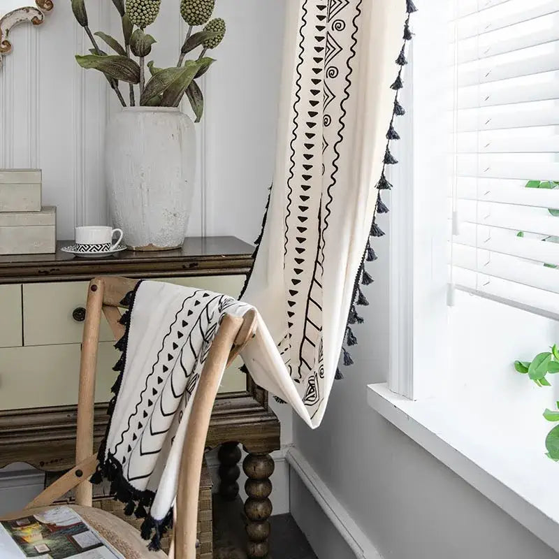 Cream-colored curtain with black geometric ethnic geometry printed patterns and tassel trim for living room decorbites bohemian ethnic