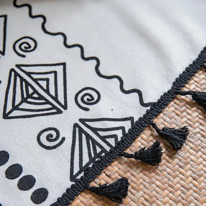 A light gray textile curtain with black bohemian ethnic geometry embroidery and braided tassel edges for living room decorbites bohemian ethnic