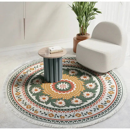 Bohemian ethnic round area rug with vibrant floral mandala design in green orange white and red on textured weave base