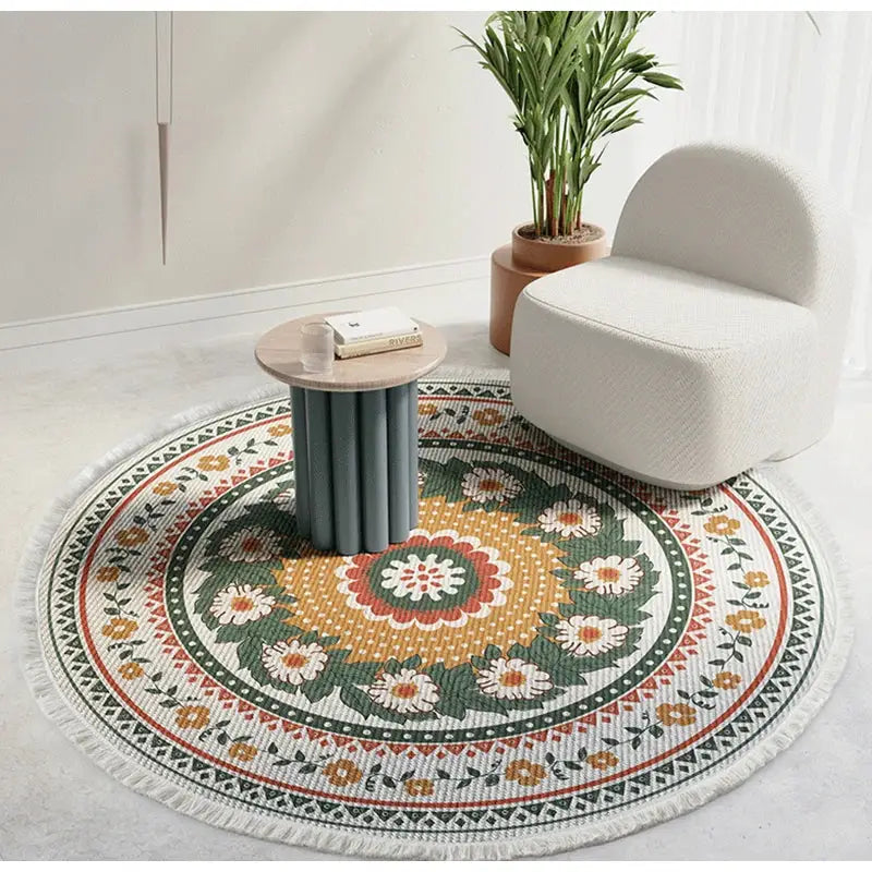 Bohemian ethnic round area rug with vibrant floral mandala design in green orange white and red on textured weave base