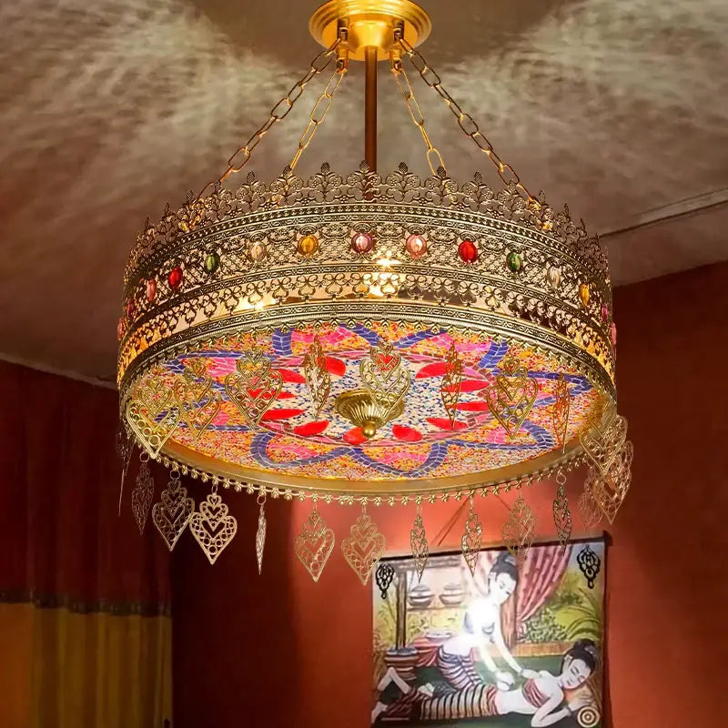 Ornate gold-toned pendant lights with intricate filigree and bohemian exotic stained glass for dining room decorbites bohemian exotic