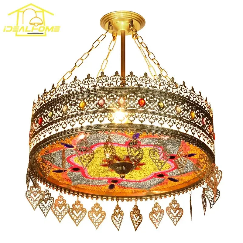 Gold-toned ornate pendant lights with heart-shaped metalwork and yellow orange mosaic glass decorbites bohemian exotic design