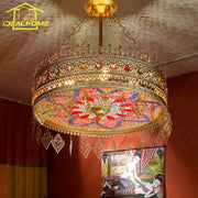 Gold-toned ornate bohemian exotic stained glass pendant lights with colorful mosaic panels and heart charms for dining room decorbites