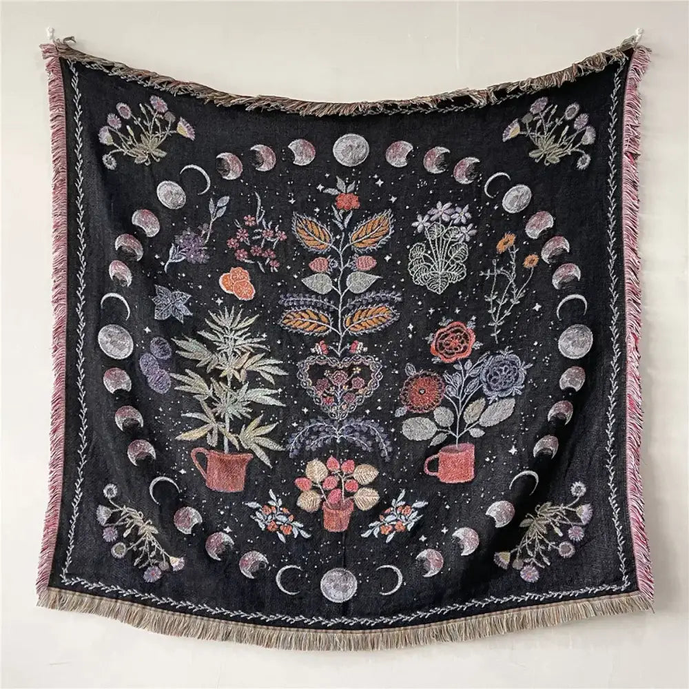Black woven bohemian throw blanket with embroidered floral and moon phases and pink fringe decorbites bohemian throw