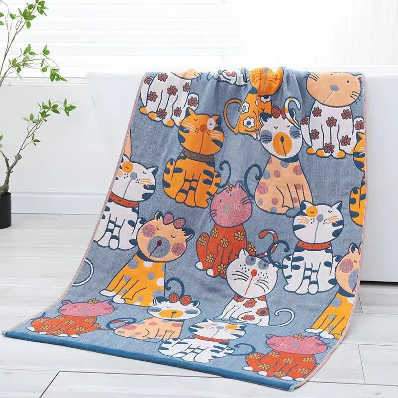 A soft blue plush bath towel with colorful cartoon cats complements decorbites bohemian floral cotton bathroom wrap