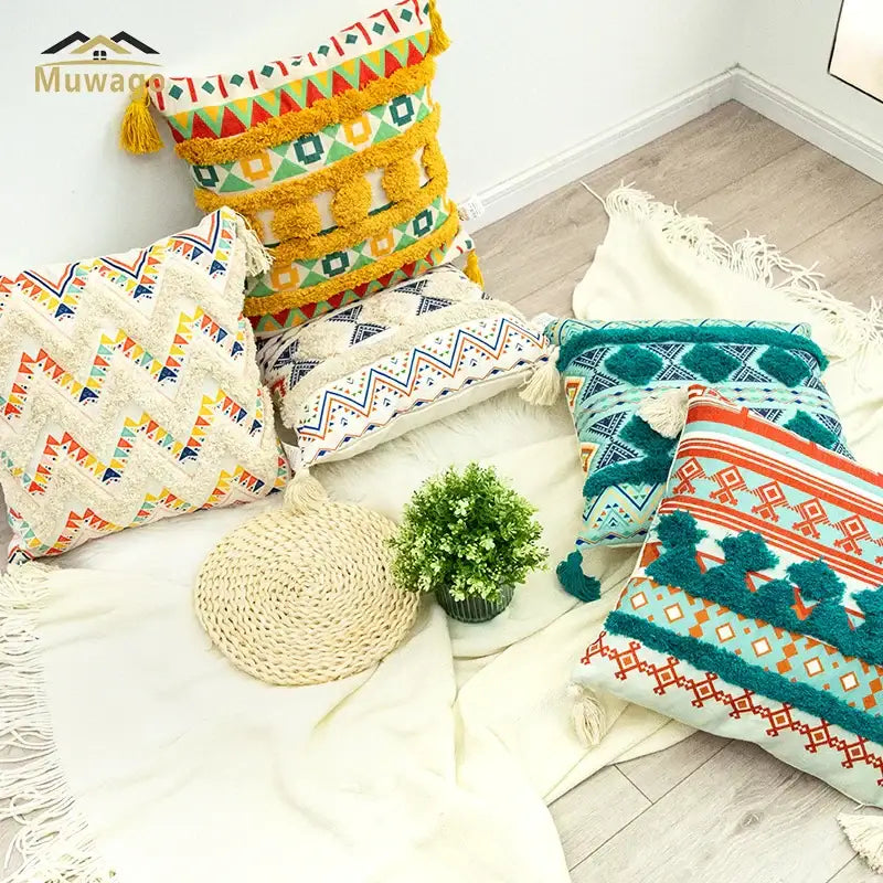 Vibrant bohemian floral throw pillow cover with geometric patterns and tassels in yellow teal orange and cream by decorbites