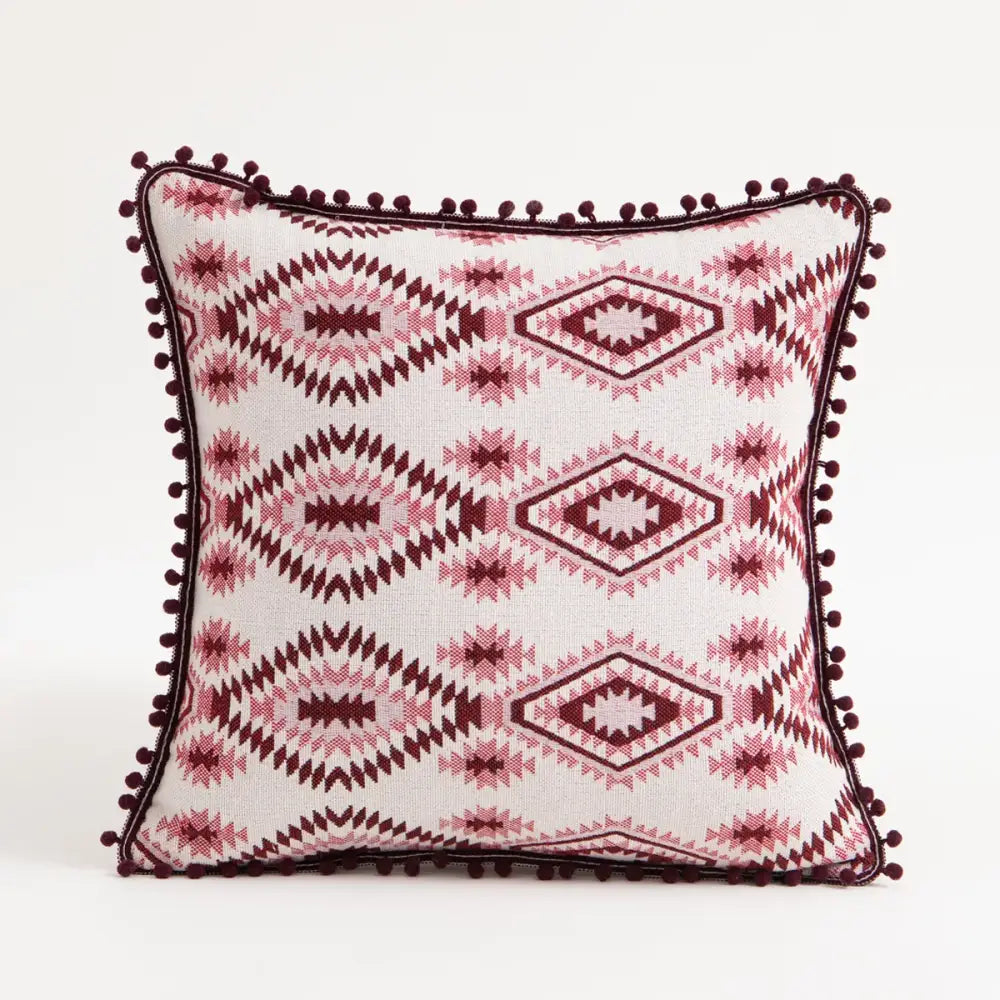 Bohemian flower cushion cover with white base, pink geometric patterns, and dark red pom-pom trim for living room decorbites bohemian flower cushion