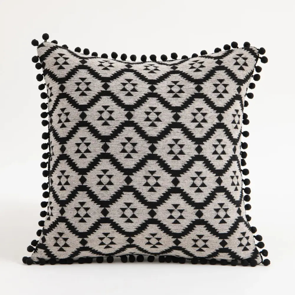 Black and gray geometric-patterned bohemian flower cushion cover with black pom-pom trim for living room decorbites bohemian flower pillow