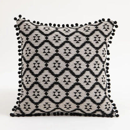 Black and gray geometric-patterned bohemian flower cushion cover with black pom-pom trim for living room decorbites bohemian flower pillow