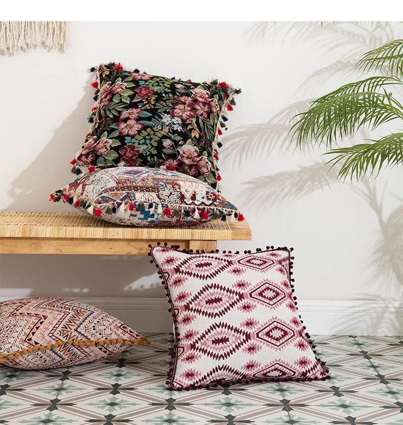 Bohemian flower cushion cover with white base maroon geometric patterns and black pom-poms by decorbites for living room decor