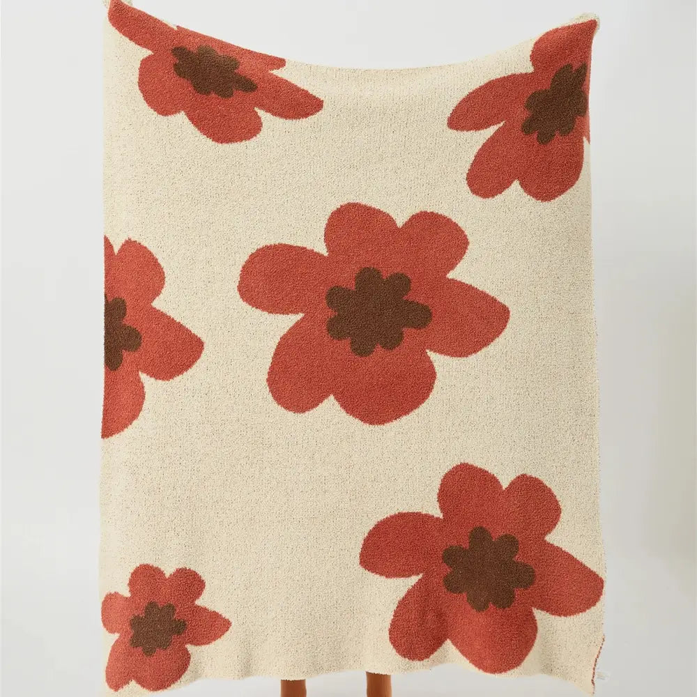 Cream-colored throw blanket with bold red poppy flowers and dark centers bohemian flower knitted decorbites design