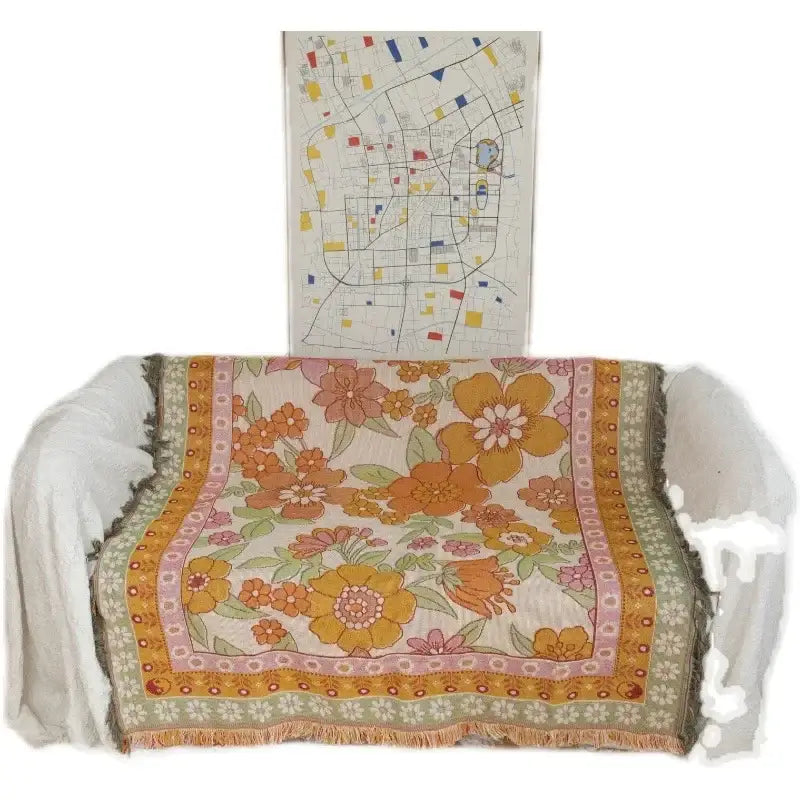 Bohemian flowers woven sofa blanket with cream base large orange pink blossoms green leaves decorbites bohemian flowers