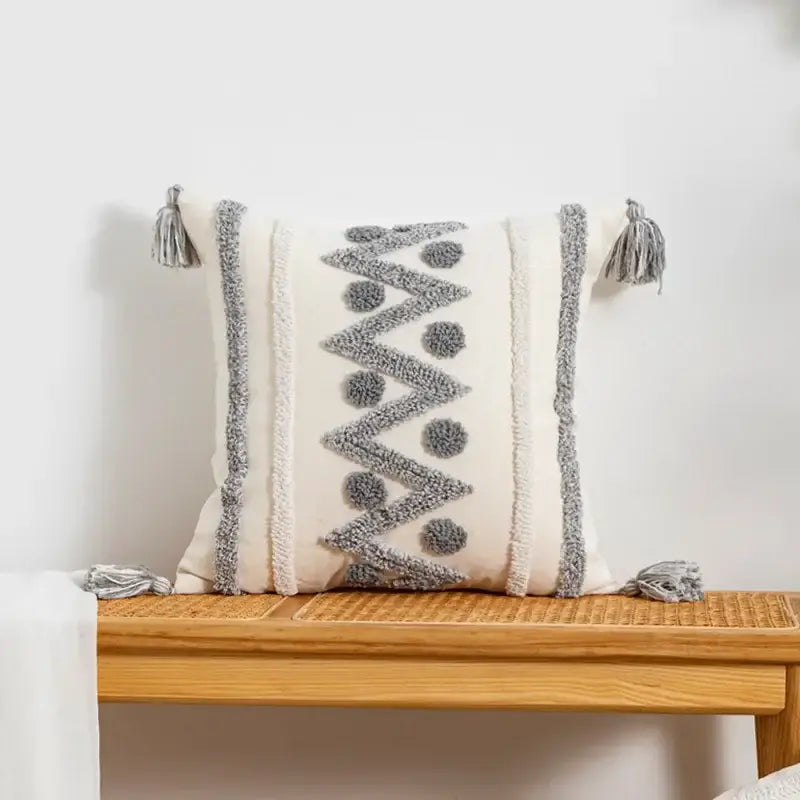 Cream-colored cushion cover with gray woven geometric patterns and tassels for bohemian decorbites pillow cover