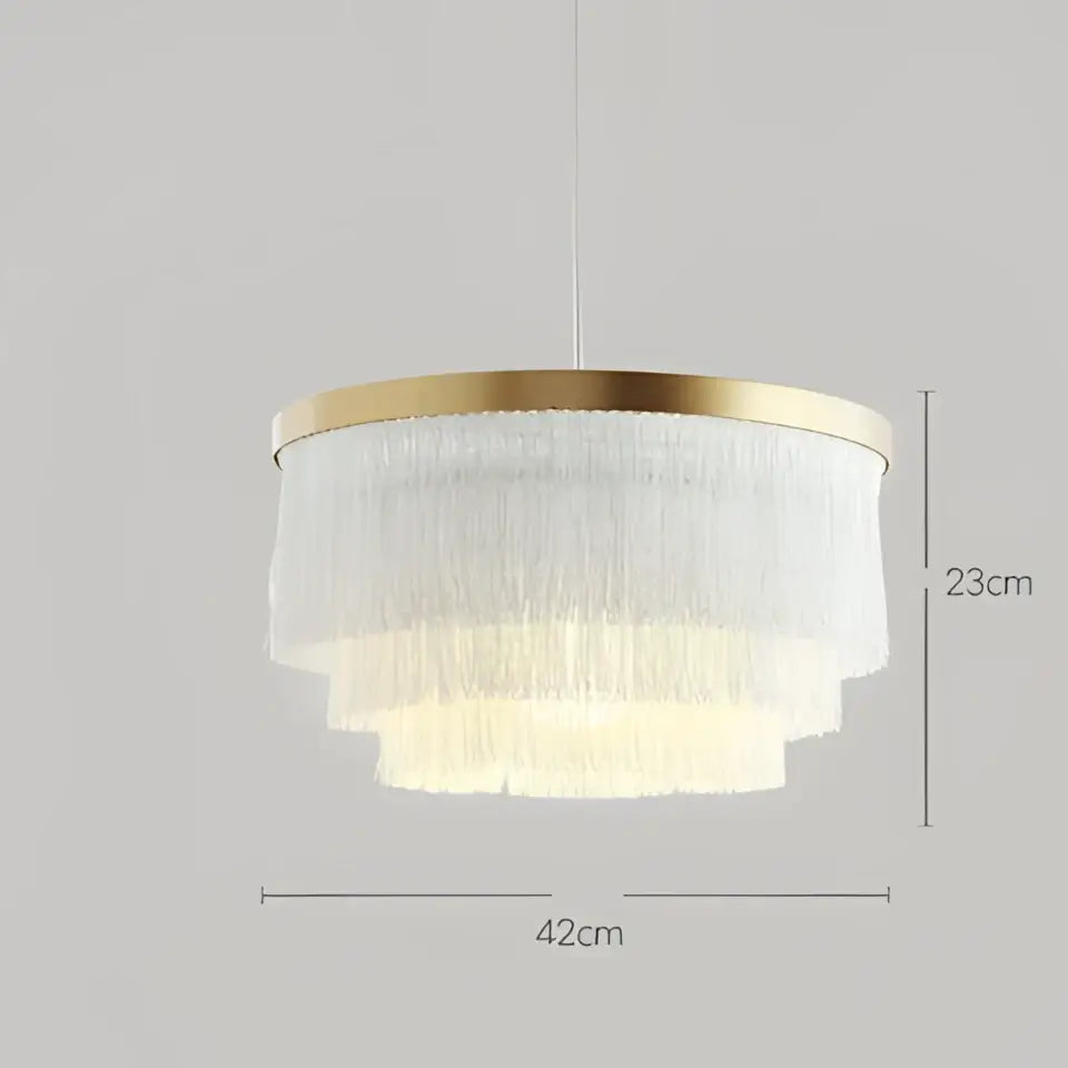 A bohemian gold tiered chandelier with gold-toned frame and cascading gray and golden glass fringe decorbites bedroom light