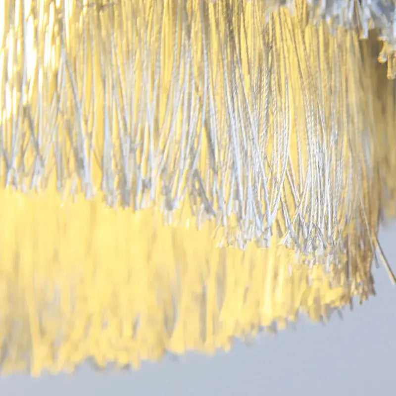 Bohemian gold tiered chandelier with shimmering yellow and silver fringe curtain for elegant bedroom decorbites bohemian gold decor