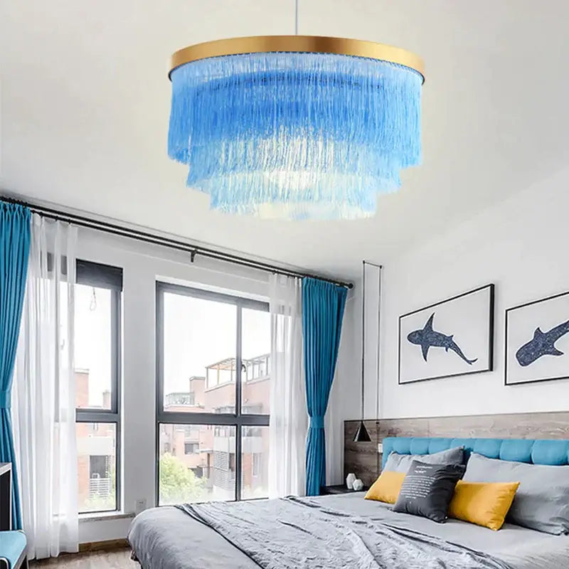 Blue tiered chandelier with gold rim and cascading translucent fringes by decorbites bohemian gold tiered bedroom light