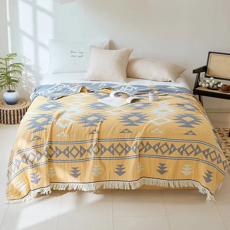 Yellow throw blanket with blue and white geometric patterns and fringed edges bohemian cotton throw by decorbites