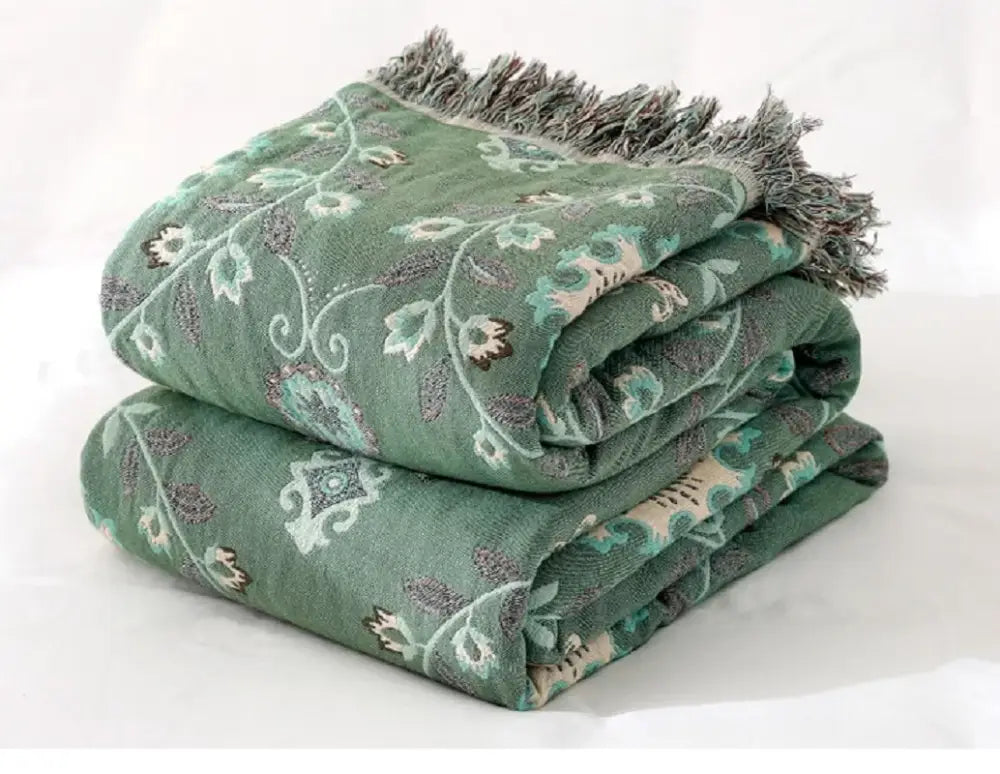 Stacked bohemian cotton throw blanket in green with floral embroidery and gray fringe for sofa or bed decorbites bohemian cotton