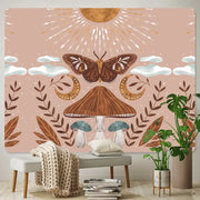 A soft pink bohemian home art tapestry featuring a stylized brown moth mushrooms and celestial motifs for decorbites bohemian home