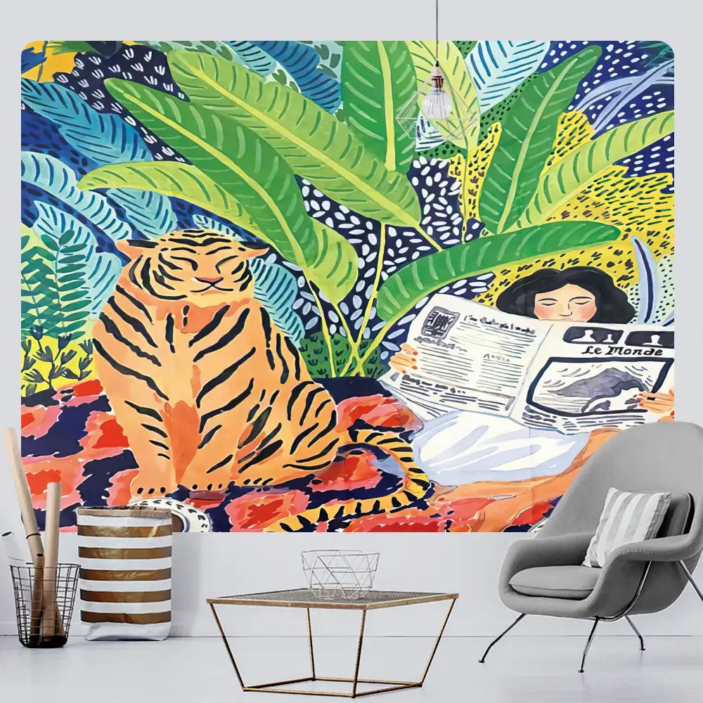 Bohemian home art tapestry featuring a vibrant tropical jungle mural with an orange tiger and woman reading newspaper
