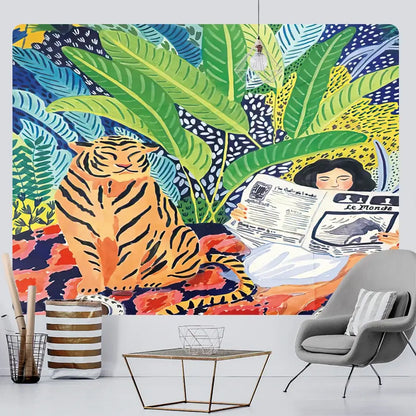 Bohemian home art tapestry featuring a vibrant tropical jungle mural with an orange tiger and woman reading newspaper