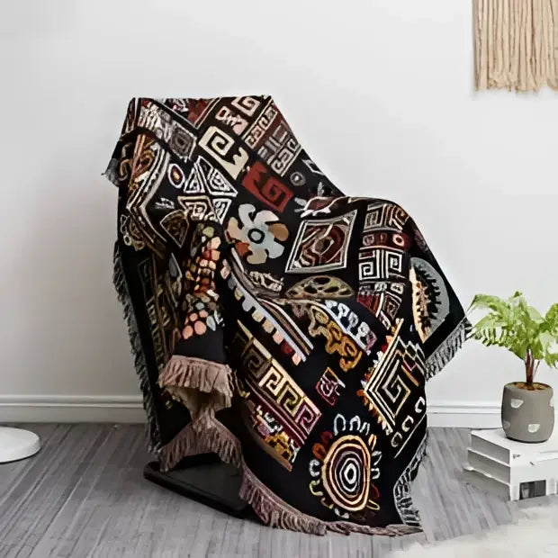Black bohemian jacquard throw blanket with intricate geometric floral patterns and fringed edges for living room decorbites