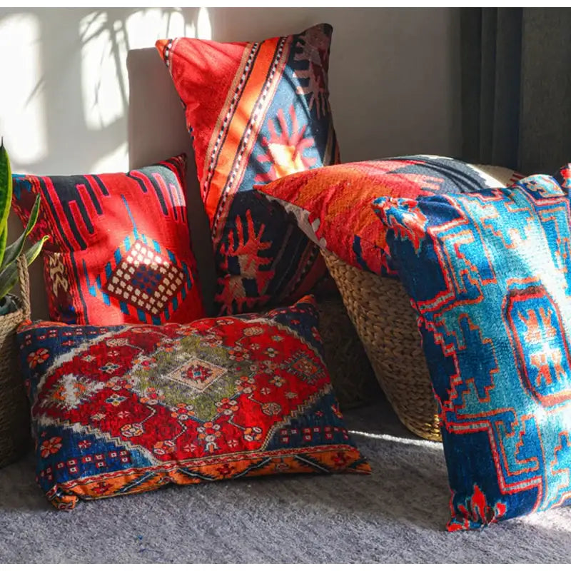 Vibrant red and blue patterned bohemian jute linen pillow covers with intricate geometric designs for living room decorbites