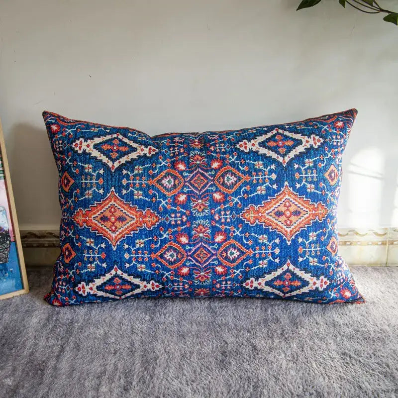Blue cushion pillow covers with intricate red and white geometric patterns in bohemian jute linen fabric decorbites bohemian jute