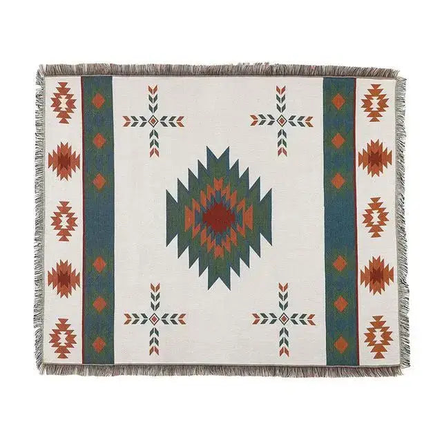 White woven bohemian knit throw blanket with teal rust diamond pattern and fringed edges for living room decorbites decor