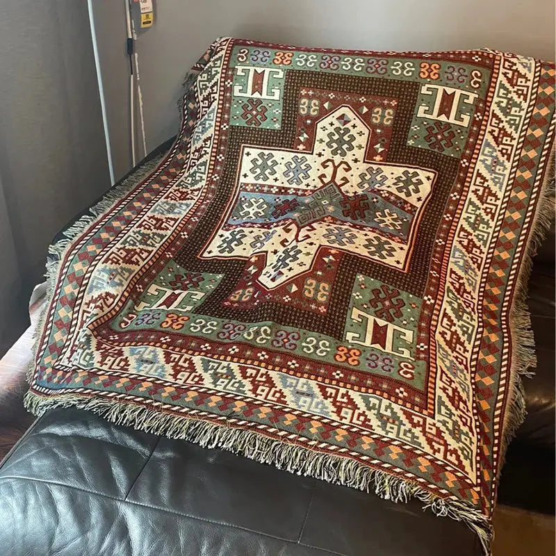 Decorbites bohemian knit throw blanket with red and blue geometric pattern and fringed edges for living room decor