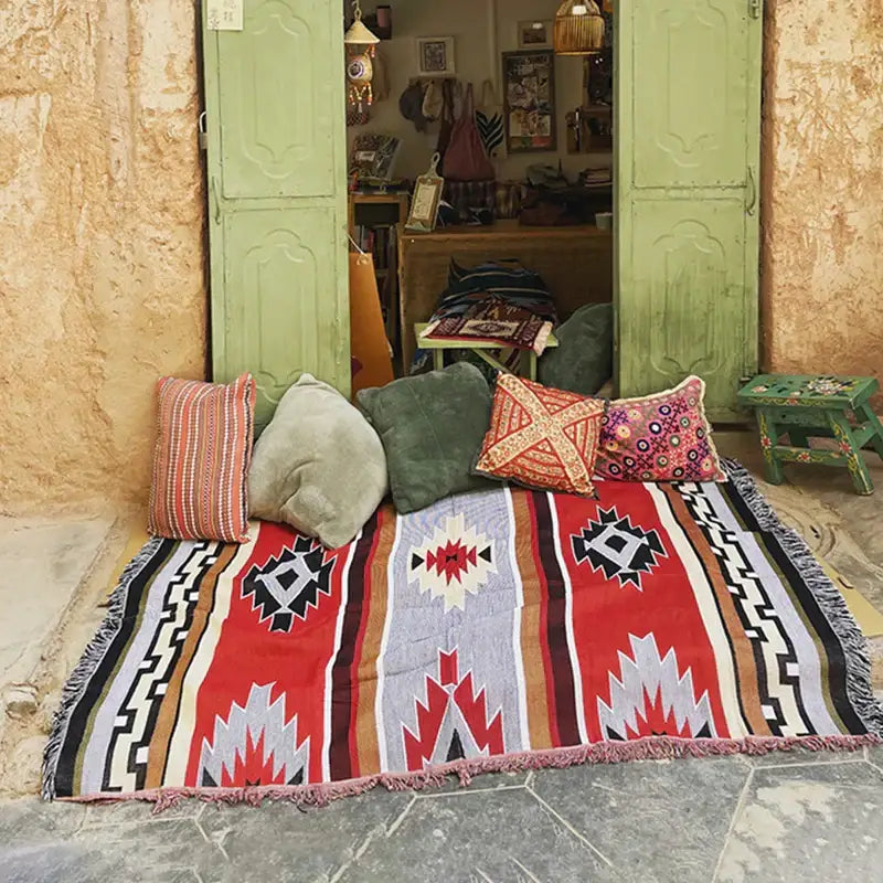 Vibrant red and beige geometric-patterned bohemian knit throw blanket with fringed edges for living room decorbites decor